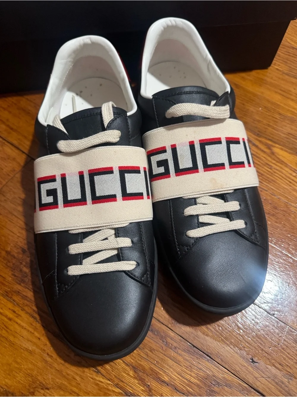 Gucci Men’s Black Leather Low-Top Sneaker with Red Accent and Logo Strap